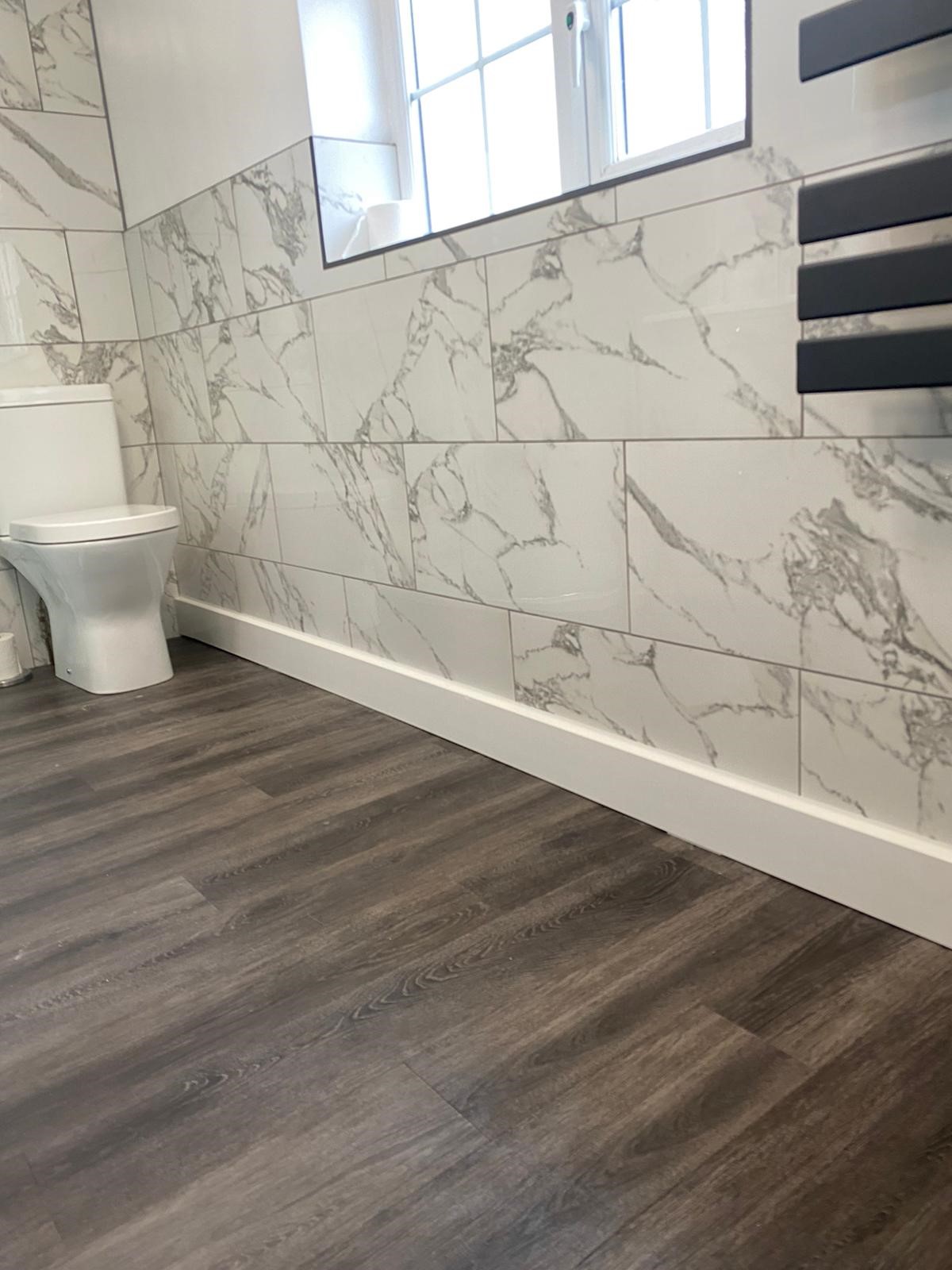 ThermaSkirt Deco BM2 in a tiled bathroom
