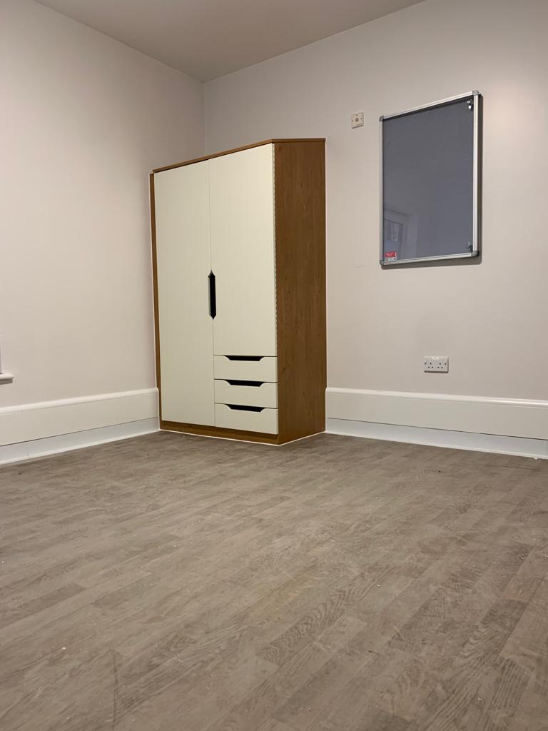 ThermaSkirt BM3 EasyClean in a healthcare bedroom with coved flooring