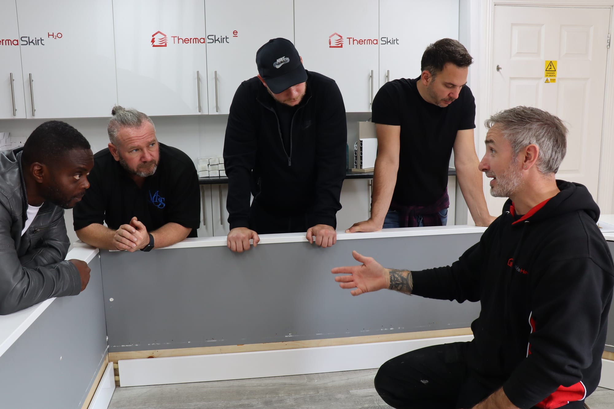An engineer delivering a technical CPD presentation to an architectural practice