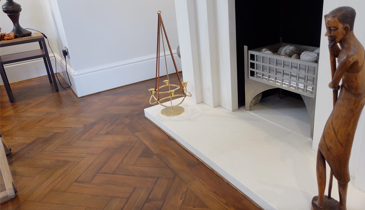ThermaSkirt Urban profile in a period living room with wooden flooring