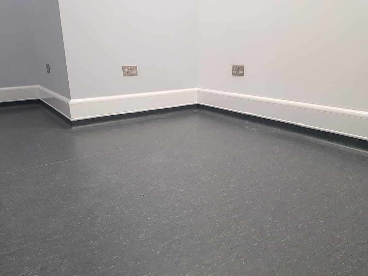 ThermaSkirt EasyClean LST in a healthcare setting with coved flooring
